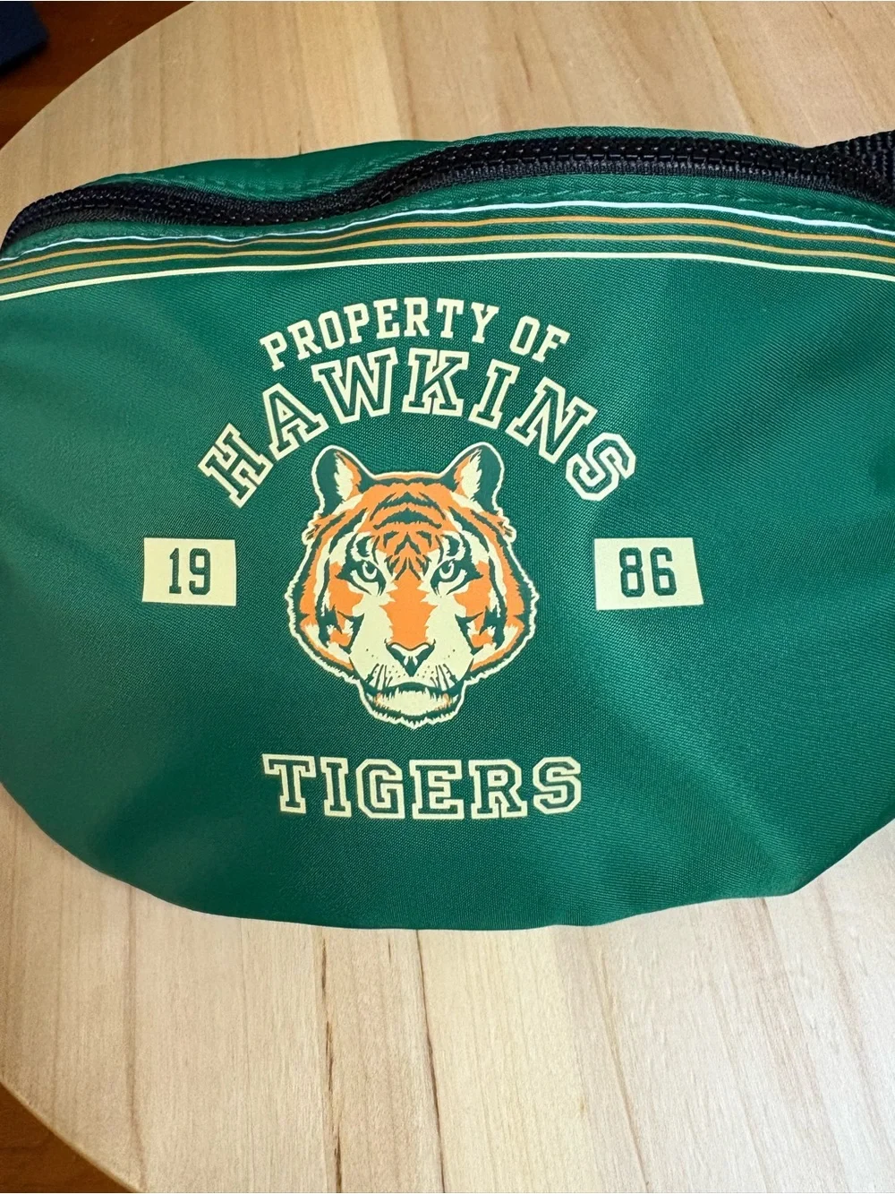 limited-edition MAC Cosmetics x Stranger Things Hawkins Tigers waist bag,